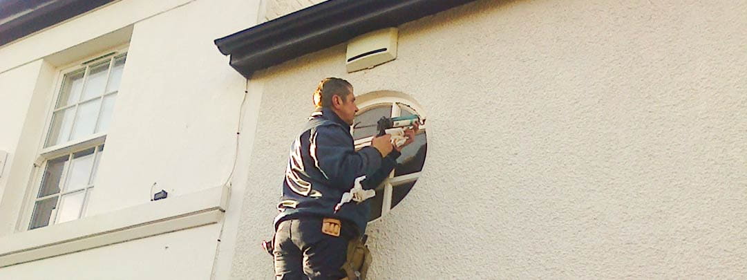 Our glazing specialist Jeff, Repairing a round (circular) window in Heswall, Wirral.